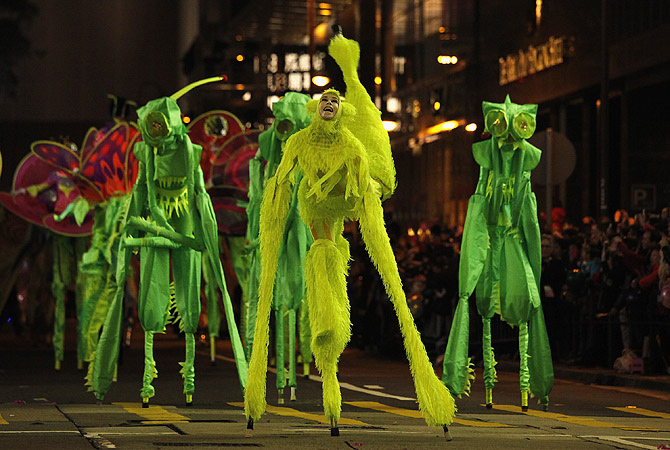 Performers from Australia's Empress Stiltdance perform during a Chinese New Year evening parade at Hong Kong's Tsim Sha Tsui shopping district.?Photo by Reuters