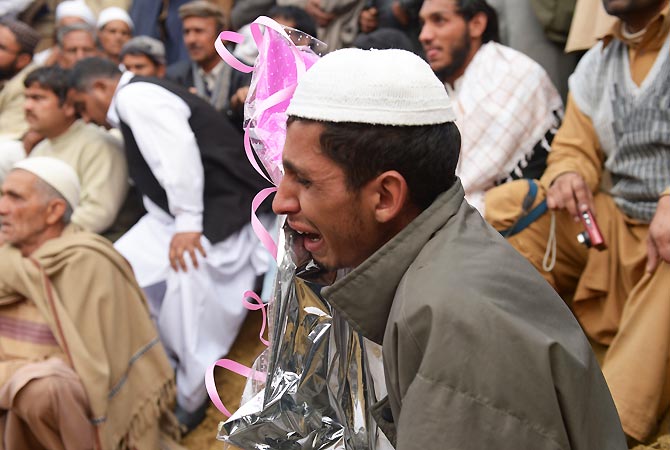 Mohammad Akhlaq's brother weeps during the funeral. -Photo by AFP