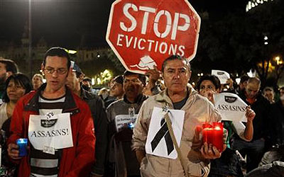 The Spanish Platform of People Evicted by Bankia (PAH) members in a protest against banks last year. —Photo (File) Reuters