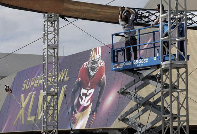 Workers build a structure outside the Mercedes-Benz Superdome on Monday, Jan. 28, 2013, in New Orleans. - Photo by AP