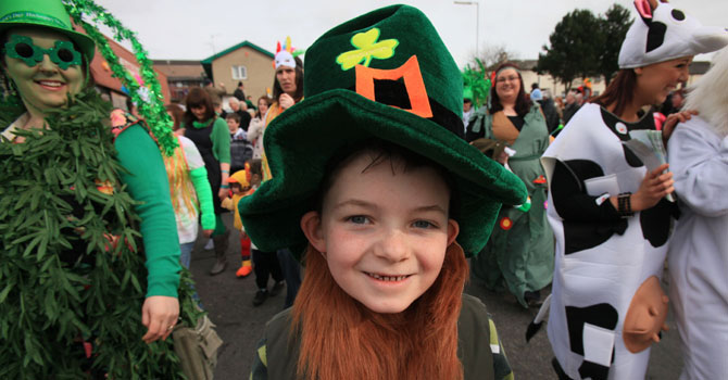 A boy from Downpatrick walked along with the St.Patrick Day parade in Downpatrick, Northern Ireland. —Photo (File) AFP