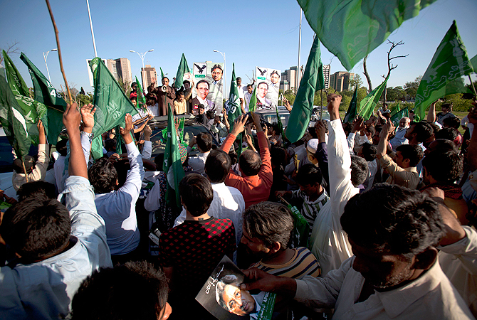 Supporters of Pakistan's former President and military ruler Pervez Musharraf rally to condemn court cases against their leader in Islamabad, Pakistan on Wednesday, April 17, 2013.
