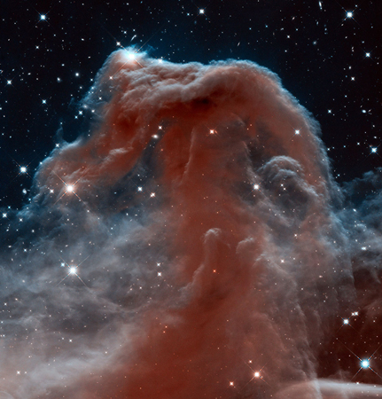This new Hubble image, captured and released by the ESA-NASA Hubble Heritage to celebrate the telescope’s 23rd year in orbit, shows part of the sky in the constellation of Orion (The Hunter). Rising like a giant seahorse from turbulent waves of dust and gas is the Horsehead Nebula, otherwise known as Barnard 33. This image shows the region in infrared light, which has longer wavelengths than visible light and can pierce through the dusty material that usually obscures the nebula’s inner regions. The result is a rat