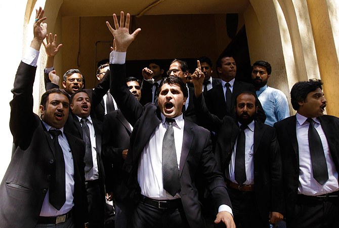 Lawyers chant slogans against Pakistan's former President Pervez Musharraf as he appears before the High Court in Rawalpindi April 17, 2013.