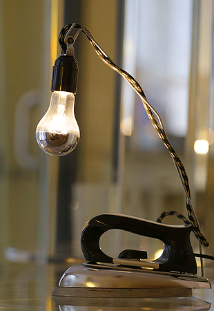 A table lamp made from an old iron is displayed at the 'Unico' showroom during the Milan's Design Fair, in Milan, Italy.
