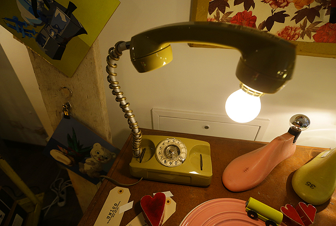 A table lamp made from an old telephone is displayed at the 'Unico' showroom during the Milan's Design Fair, in Milan, Italy.