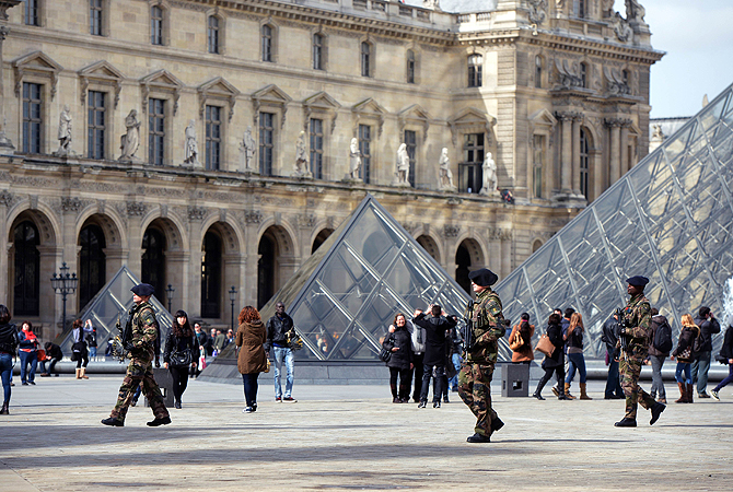 French militaries patrol at the "Cour Carree" of the Louvre Museum in Paris. Paris's Louvre museum today reopened its doors to the public after a walkout by some staff in protest at gangs of pickpockets operating at the world famous art gallery. Around 20 police officers have now been drafted in to patrol the museum in response to staff concerns, Louvre officials told AFP. The day before, the Louvre failed to open when around 200 employees refused to work saying the museum had become plagued by gangs of increasingl