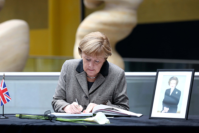 German Chancellor Angela Merkel signs a book of condolence in memory of former British Prime Minister Margaret Thatcher, who died on April 8, 2013 at the age of 87 after suffering a stroke at the British embassy in Berlin, Germany.