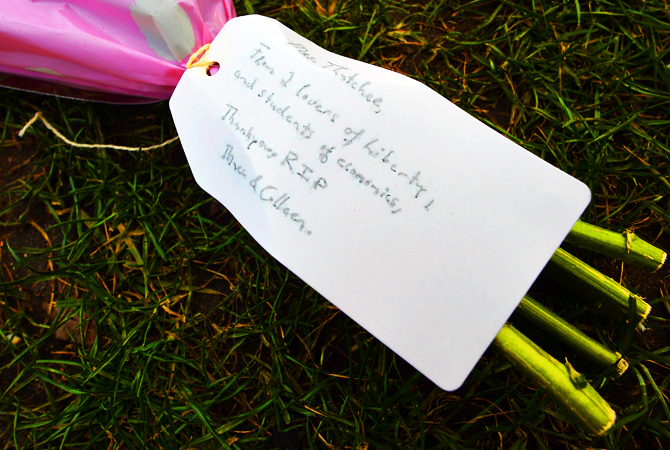 A floral tribute for late British former prime minister Margaret Thatcher lies on the grass outside the Houses of Parliament in central London on April 10, 2013. British lawmakers interrupted their holidays for a special session of parliament on April 10 to pay tribute to Margaret Thatcher, died on April 8 aged 87 after suffering a stroke.