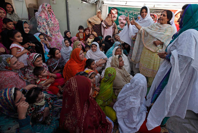 Nighat Orakzai attends a clandestine campaign rally on a roof of a building.
