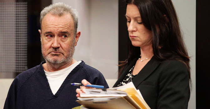 Peter Robbins (L), the former voice of Charlie Brown on animated TV specials and movies, reacts as he is sentenced to probation in San Diego, on charges that he stalked and threatened a former girlfriend and La Jolla plastic surgeon. -Photo by Reuters