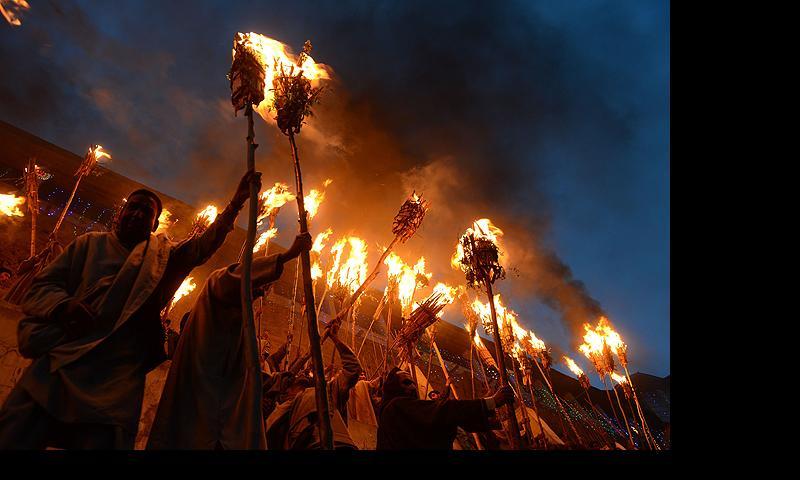 Kashmiri Muslims hold torches aloft during the annual Aishmuqaam festival at the shrine of Sufi saint Zain-ud-din Wali in Aishmuqaam, some 75 kms (47 miles) south of Srinagar, on April 24, 2013. The farming community in Kashmir celebrates the 'festival of lights', carrying torches and offering prayers, marking the end of winter and the beginning of the agricultural season. — AFP Photo