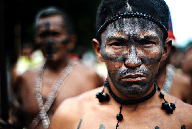 Leaders of the Munduruku Amazon Indian tribe, from the Tapajos and Teles Pires river basins, hold a protest march after a meeting to discuss their opposition to the government's plans to build the Tapajos hydroelectric project, which the leaders claim will affect more than 30 indigenous communities, in Jacareacanga, western Para state, April 26, 2013. The leaders decided to reaffirm their opposition to the dams and burnt a document sent by the government explaining the goals of the project, a series of five dams wh
