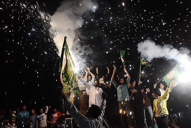 Supporters of former Pakistani Prime Minister and head of the Pakistan Muslim League-N (PML-N), Nawaz Sharif, celebrate with fireworks the victory of their party a day after landmark general elections, in Lahore, on May 12, 2013. — AFP Photo