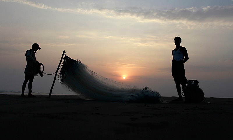 Men from a Rohingya internally displaced persons (IDP) camp prepare to fish along a beach near their camp, outside of Sittwe, May 18, 2013. — Reuters Photo
