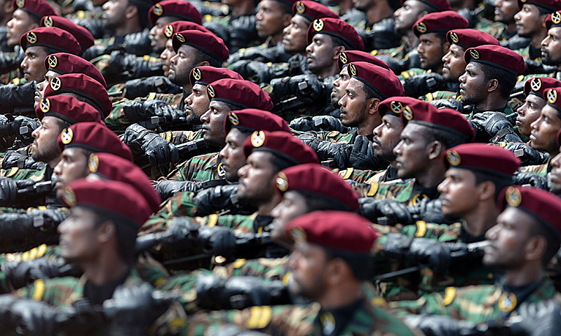 Sri Lankan commandos march during a Victory Day parade in Colombo on May 18, 2013. Sri Lanka celebrates War Heroes month with the parade which celebrates the fourth anniversary of the military defeat of the Tamil Tiger rebels in May 2009, ending a 37-year long separatist conflict. — AFP Photo