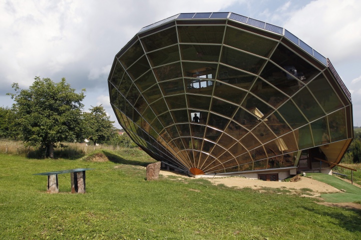 The Heliodome, a bioclimatic solar house is seen in Cosswiller in the Alsacian countryside near Strasbourg, Eastern France, August 4, 2011. The house is designed as a giant three-dimensional sundial, set on a fixed angle in relationship to the sun's movements to provide shade during the summer months, keeping the inside temperature cool, and during Fall, Winter and Spring sunlight enters the large windows as the sun's position is lower in the sky, thus warming the living space.