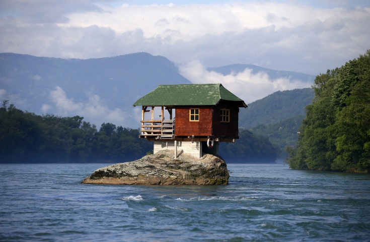 A house built on a rock on the river Drina is seen near the western Serbian town of Bajina Basta, about 160km (99 miles) from the capital Belgrade May 22, 2013. The house was built in 1968 by a group of young men who decided that the rock on the river was an ideal place for a tiny shelter, according to the house's co-owner, who was among those involved in its construction.