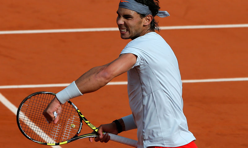 Defending champion, Spain's Rafael Nadal celebrates as he defeats Japan's Kei Nishikori during their fourth round match of the French Open tennis tournament at the Roland Garros stadium Monday, June 3, 2013 in Paris. Nadal won 6-4, 6-1, 6-3. — AP Photo