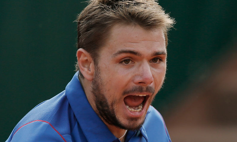 Switzerland's Stanislas Wawrinka celebrates after winning against Richard Gasquet of France in their fourth round match at the French Open tennis tournament, at Roland Garros in Paris, Monday June 3, 2013. — AP Photo