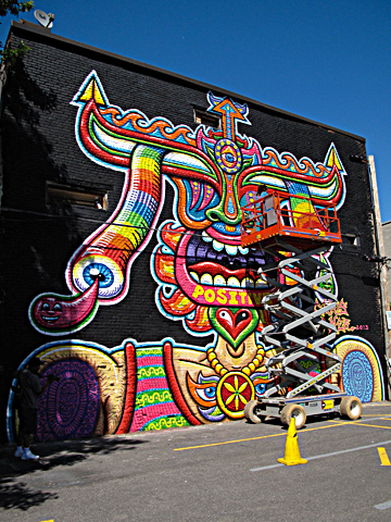 A mural in progress is seen on the side of a building during the Mural Festival on June 6, 2013 in Montreal, Canada. — AFP Photo