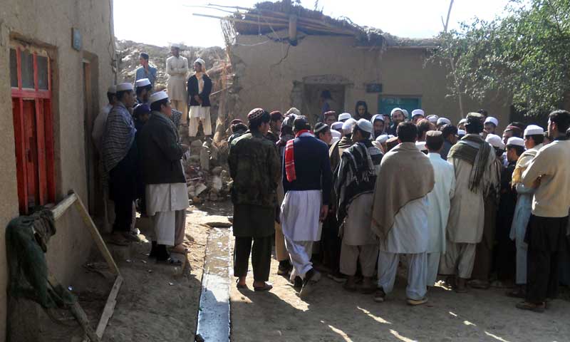 Students gather at a destroyed seminary after a US drone strike in the Hangu district of Khyber Pakhtunkhwa province, Nov 21, 2013. &mdash; Photo by AFP