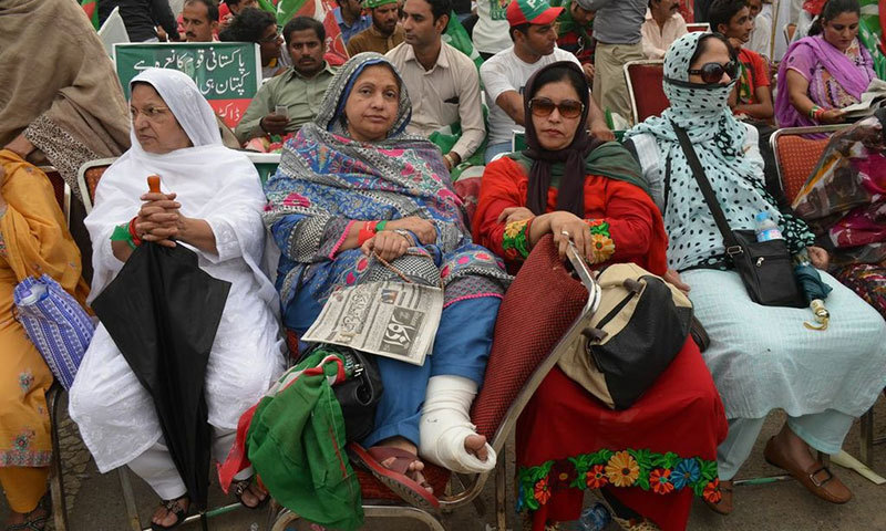 A 50-year-old woman, who has come to participate in the rally despite a broken leg, says she is hopeful that the Pakistan Tehreek-i-Insaf (PTI) will take its mandate back through the protest today.—Photo by Irfan Haider