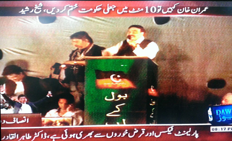 Awami Muslim League (AML) leader Sheikh Rasheed on stage addressing the crowd at the PTI protest rally at D-Chowk in Islamabad.—Photo from DawnNews TV grab