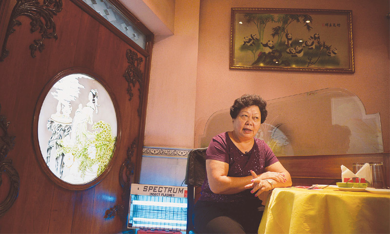 Monica Liu in her restaurant in Kolkata. Suspected of being a spy, 9 year old Liu & her family were sent to detention camps in the deserts of Rajasthan. Source ~ dawn.com