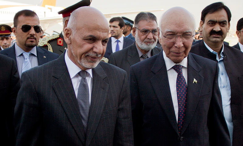 Adviser on National Security and Foreign Affairs Sartaj Aziz (R) greets Afghan President Ashraf Ghani at Chaklala airbase in Rawalpindi, Pakistan, Friday, November 14, 2014. - AP photo