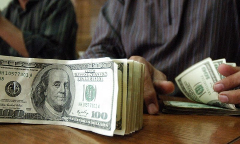 Dollar Breaks Rs102 Barrier Newspaper Dawn Com A Stani Currency Dealer Counts Us Dollars At Exchange Afp