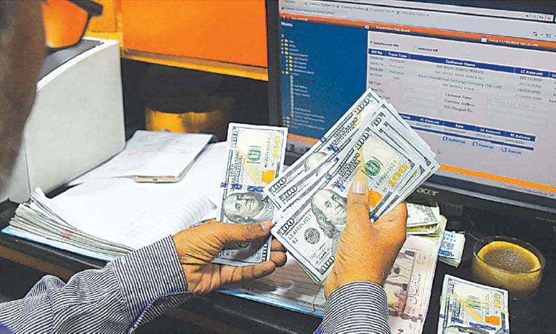 Currency Business Falls By 70pc In Two Months Newspaper Dawn Com A Stani Dealer Counts Us Dollars At Currency Exchange The Ru Is One