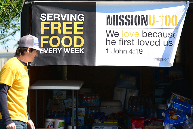 Jason Bray, a board member for the non-profit "Mission U-too" walks toward his truck loaded with food supplies to serve free food near a distribution center where supplies like water and clothing, including medical supplies, are being dropped off or picked up as needed, in West, Texas, two days after a deadly fertilizer plant blast occured. While rescuers in Texas were set to return to the rubble in their continuing search for survivors after the massive blast killed as many as 15 people and destroyed dozens of hom