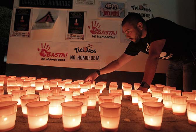 An activist from a gay rights organisation attends a candlelight vigil during a protest to mark International Day Against Homophobia and Transphobia in San Jose.—Photo by Reuters