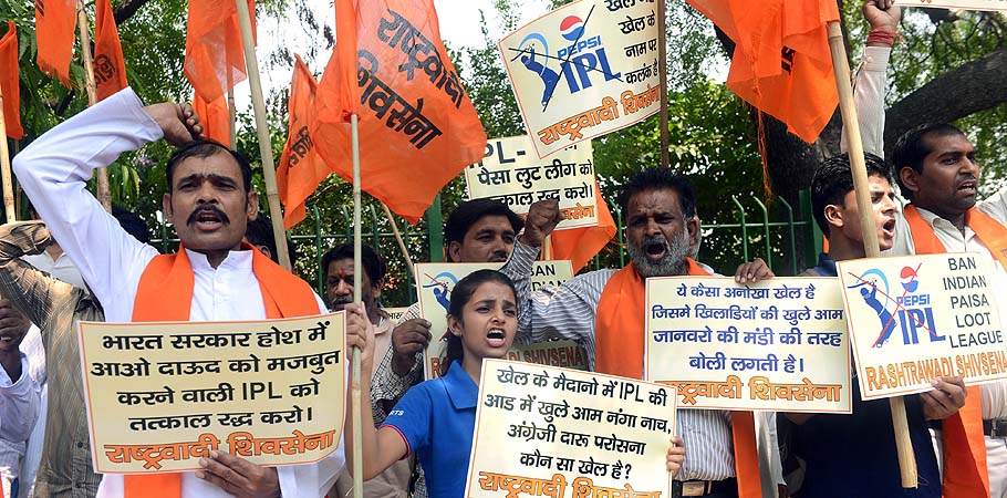 Activists from India's Rashtrawadi Shiv Sena shout slogans as they demand the banning of the Indian Premier League (IPL) Twenty20 cricket tournament during a protest in New Delhi. Indian police said that they had arrested three cricketers including Test bowler Shanthakumaran Sreesanth, after they allegedly accepted tens of thousands of dollars for spot-fixing. Eleven bookmakers were also arrested in connection with the inquiry, said Delhi Police Commissioner Neeraj Kumar, as he gave details of three games in the on