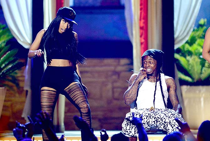 Nicki Minaj and rapper Lil Wayne perform onstage during the 2013 Billboard Music Awards at the MGM Grand Garden Arenain Las Vegas, Nevada.—Photo by AFP