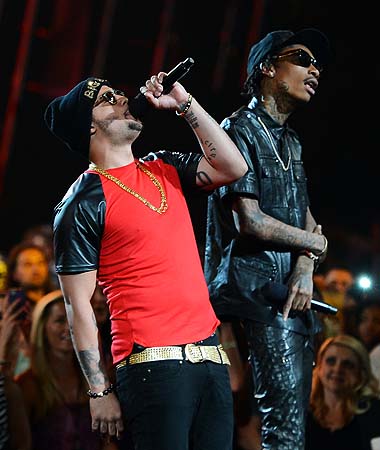 Sky Blu and Wiz Khalifa speak onstage during the 2013 Billboard Music Awards at the MGM Grand Garden Arena in Las Vegas, Nevada.—Photo by AFP
