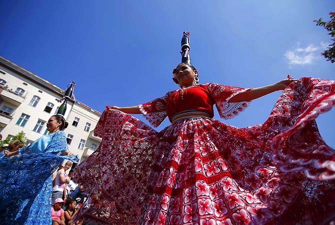 Revellers perform during the Karneval der Kulturen (Carnival of Cultures), a street parade of Berlin's ethnic minorities, in Berlin.—Photo by Reuters