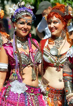 Dancers in colorful costumes prepare to perform during a parade through the streets of Berlin as part of the Carnival of Cultures festival.—Photo by AFP