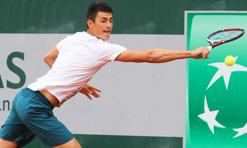 Australia's Bernard Tomic returns against Romania's Victor Hanescu. —AP Photo