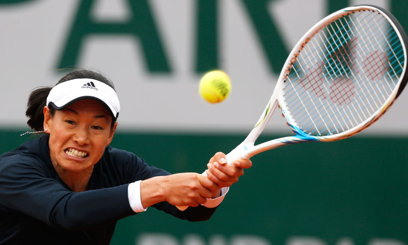 Japan's Kimiko Date-Krumm returns the ball to Australia's Samantha Stosur. —AP Photo