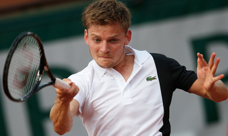 David Goffin of Belgium returns against Serbia's Novak Djokovic during their first round match. —AP Photo