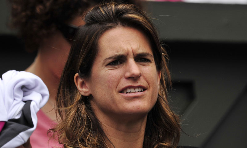 2006 Champion Amelie Mauresmo watches her French compatriot Bartoli in action