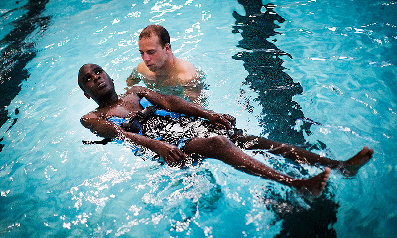 Ahmat Djouma learns to float in the pool with his counselor Adam Dwyer at Camp Abilities in Brockport, New York.