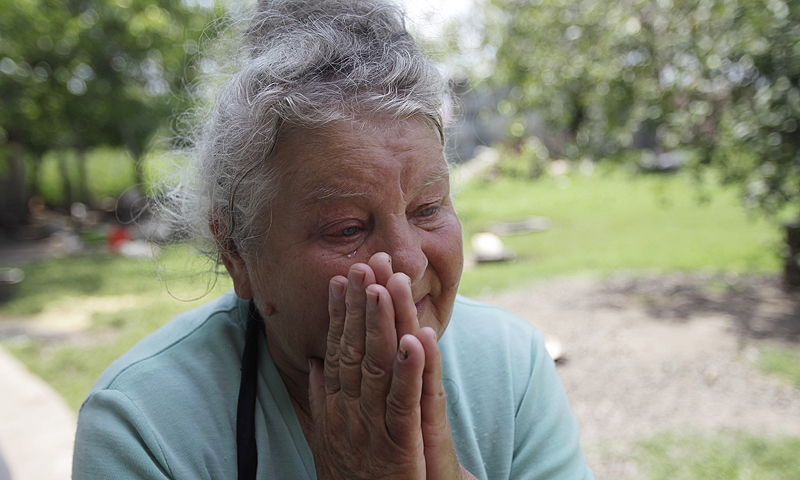The mother of rape victim Irina Krashkova, 69-year-old Maria cries during an interview with the Associated Press, in the town of Vradiyevka, southern Ukraine. Corruption, lawlessness and the impunity of government officials and their wealthy friends, be it a national lawmaker, a businessman in an expensive car or a small town cop, have increased significantly since the 2010 election of President Viktor Yanukovych, watchdogs say.—Photo by AP