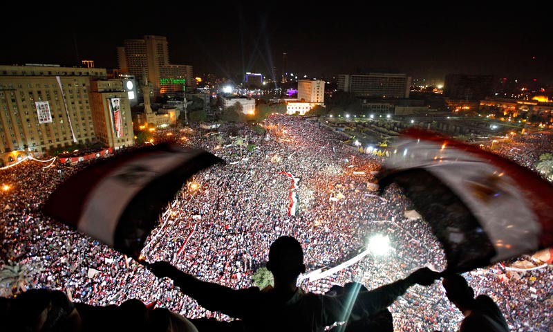 Anti-Morsi protesters chant slogans during a mass protest to support the army in Tahrir square. — Reuters Photo