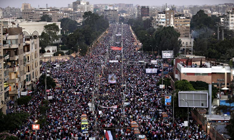 Prosecutors opened an investigation of ousted President Mohammed Morsi on charges including murder and conspiracy with the Palestinian militant group Hamas, fueling tensions amid a showdown in the streets between tens of thousands of backers of the military and supporters calling for the Islamist leader's reinstatement. — AP Photo