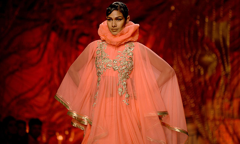 A model presents a creation by Indian fashion designer Gaurav Gupta during the PCJ Delhi Couture Week 2013.—Photo by AFP