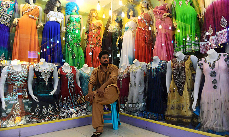 A shopkeeper waits for customers for the Eid festival, which marks the end of the Muslim holy month of Ramadan.—Photo by AFP