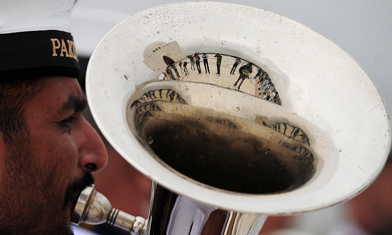 A Pakistani Naval band member plays a tuba at the mausoleum of the founder of Pakistan Muhammad Ali Jinnah, Karachi. -Photo by AFP